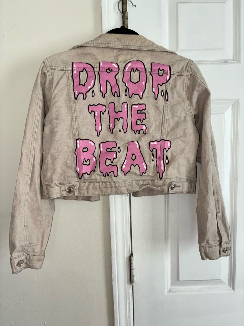 Beige Cropped Jacket with Pink "Drop The Beat" Graphic